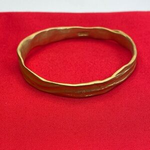 Elegant DKNY Gold Tone Wavy Bangle Bracelet